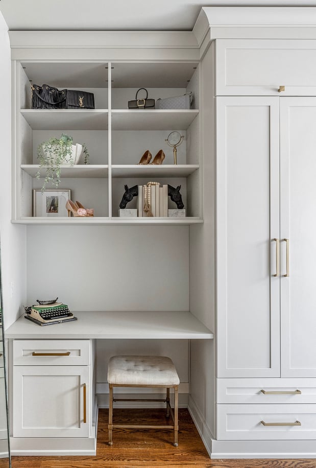 Home office and work space with custom shelves and cabinets by California Closets Nashville, Tennessee.