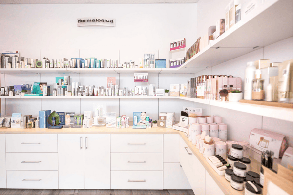 Front view of shelving and drawers used to display and store skincare products