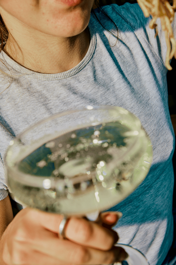 woman holding glass of champagne