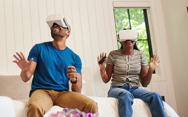 Dad and daughter gaming on VR at home