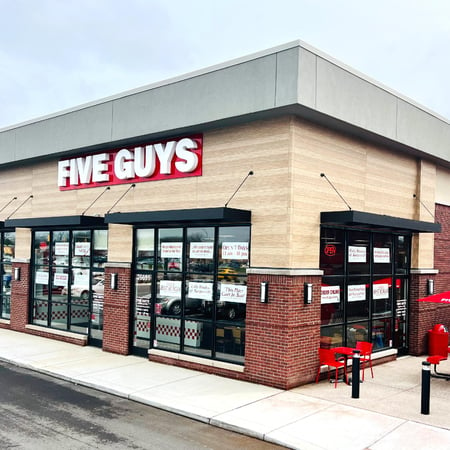 Exterior photograph of the Five Guys restaurant at 26691 Ford Road in Dearborn Heights, Michigan.