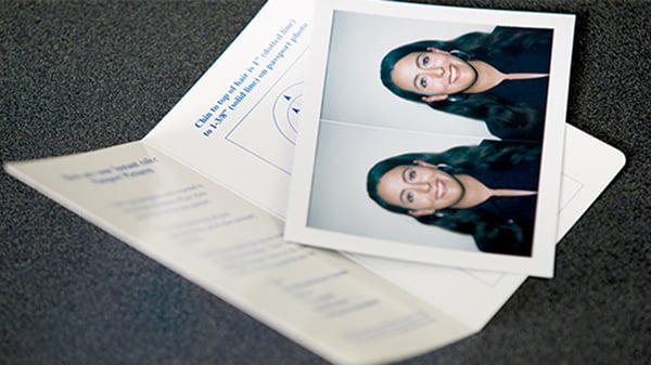 brunette woman's passport photos taken at the ups store