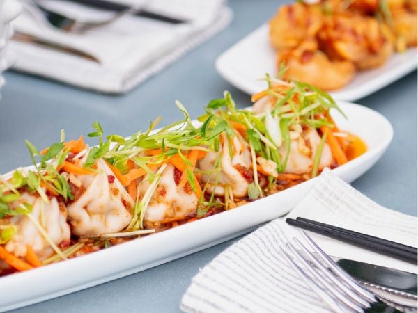 Soup Dumplings with Bang Bang Shrimp in the background