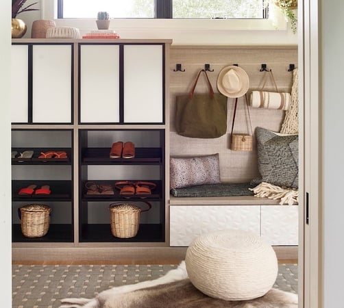 Two Tone Mudroom with brown and black tones, hooks and a bench by California Closets Northern Michigan