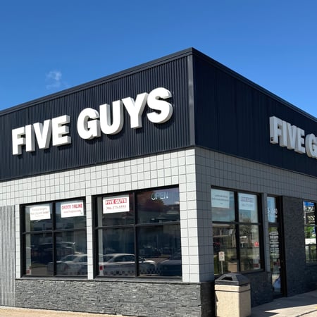 Exterior photograph of the Five Guys restaurant at 1840 8th Street East in Saskatoon, Canada.