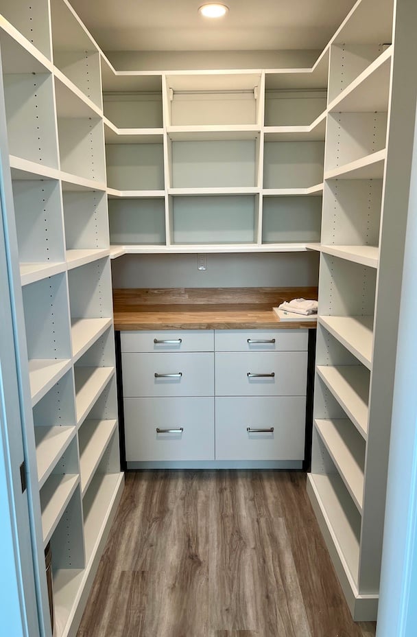 Custom Pantry with a Butcher Block countertop and shelves for storage