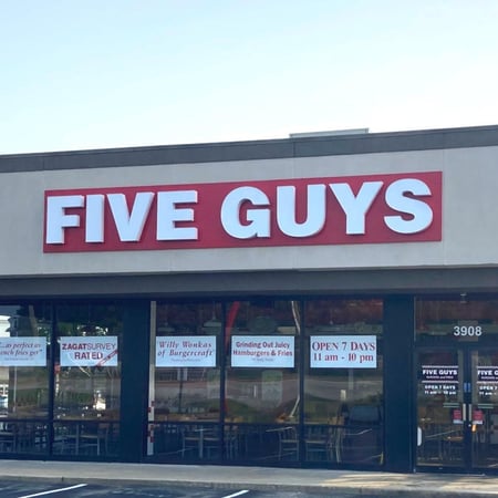 Exterior photograph of the entrance to the Five Guys restaurant at 3908 Grandview Drive in Simpsonville, South Carolina.