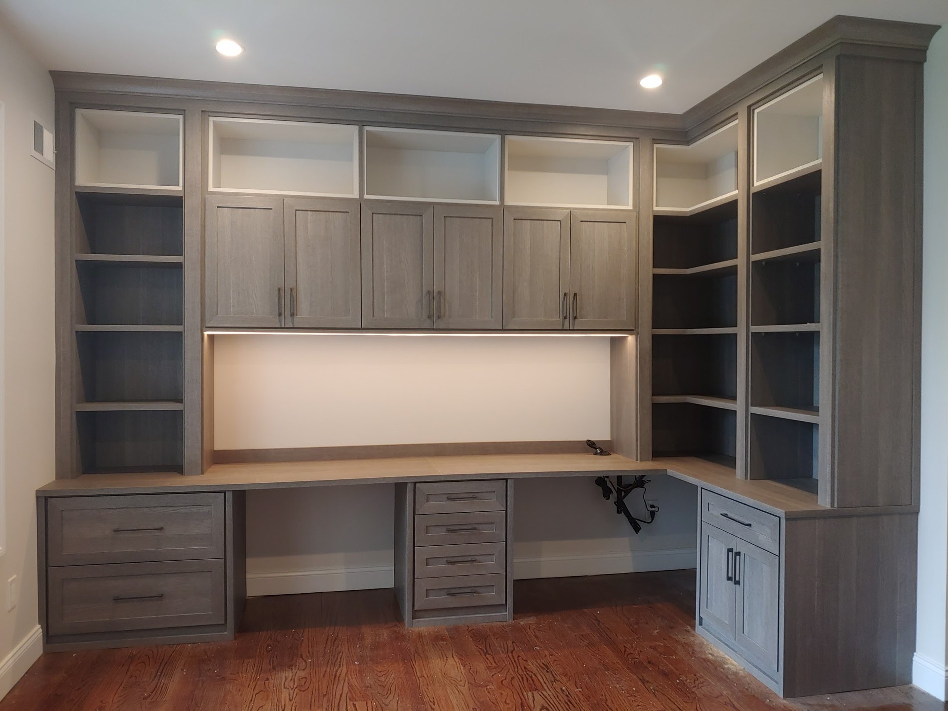 Office desk with upper cabinets, shelving and drawers below in grey