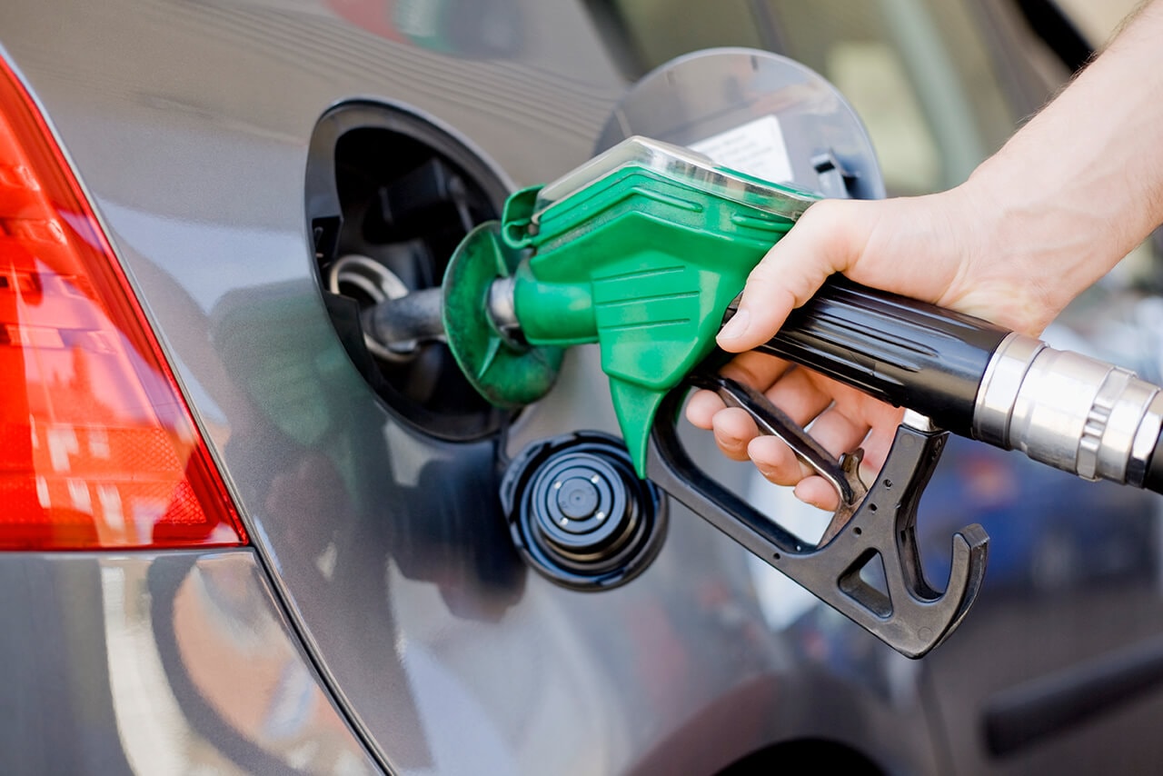 Close up of person filling their car with petrol