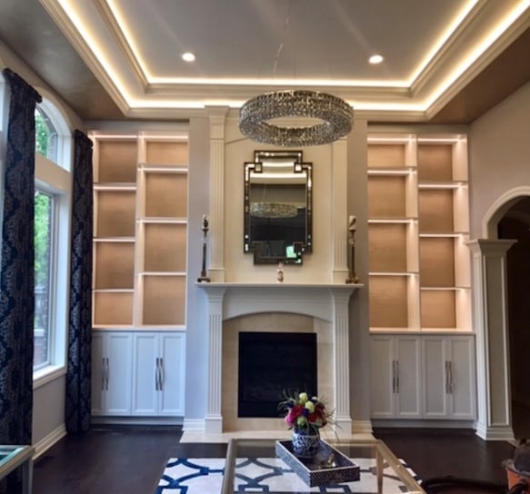 Built-in cabinets and shelving around fireplace for living room storage solutions and home organization