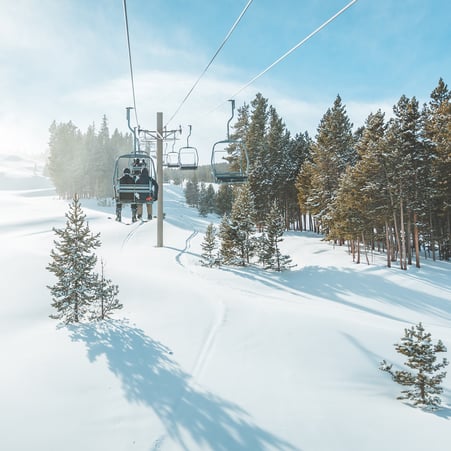 Ski lift on a snow cover mountain.