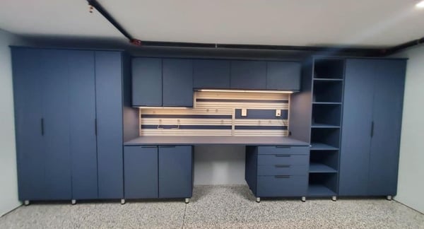 A sleek garage with storage by California Closets Charlotte, North Carolina.