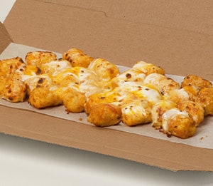 Melty 3-Cheese Loaded Tots Tots - Golden brown potato tots topped with a melty blend of cheese made with mozzarella, cheddar, provolone, and creamy Alfredo sauce.