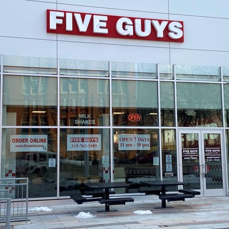Store front of Five Guys at 1100 Cecil B. Moore Ave. in Philadelphia, PA.