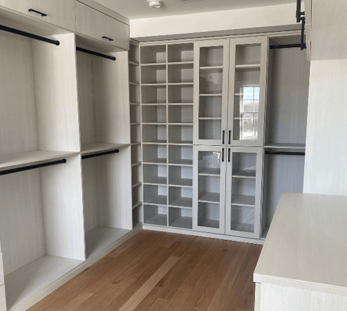 Img 4 California Closets Westchester County New York Dressing Room Walk-in Closet in White with Black Drawer Handles and Hanging Rods