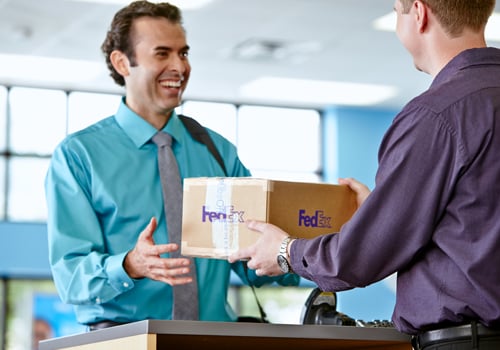 Man at counter shipping a package