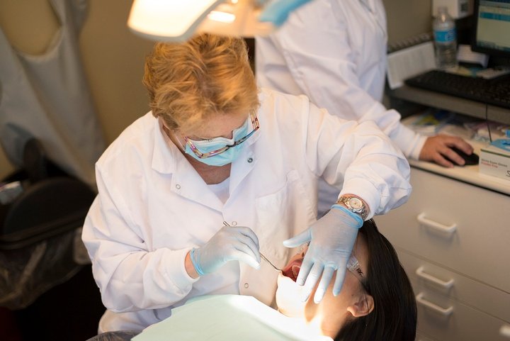 Dental Hygienist working on patient
