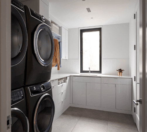 Img 6 California Closets Westchester County New York Custom White Laundry Room with Closed Cabinetry for Laundry supplies and space for a double washer and dryer