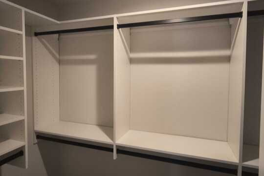 Virginia Beach - Custom closets - Walk-in closet with dual hanging rods and open shelving in neutral tones.
