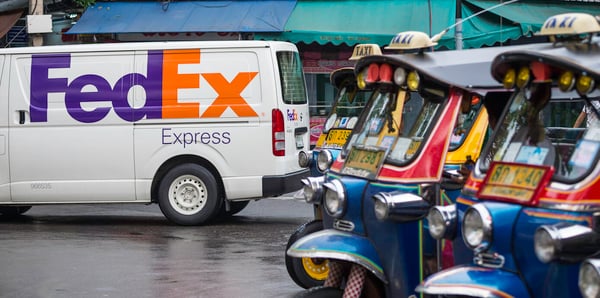 Outside picture of road, FedEx van and taxis