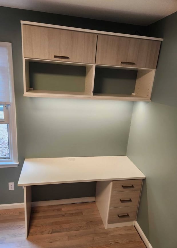 Floating cabinets and a desk with integrated drawers.
