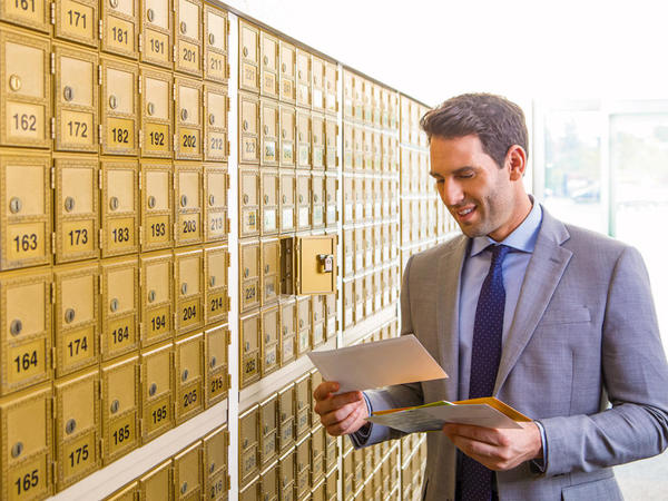 Mailboxes At The Ups Store Williamsport!    At 1784 East 3rd Street - man reading mail at his mailbox rental at the ups store