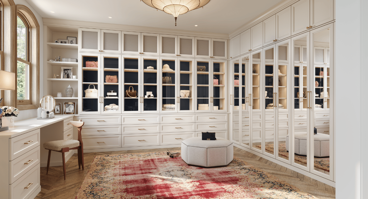 Luxury custom white walk-in closet design in Boca Raton and South Palm Beach, Florida featuring mirrored doors, built-in vanity, integrated desk, and premium storage by California Closets Boca Raton