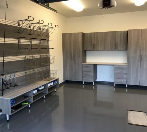Grey garage workspace storage with wall accessories