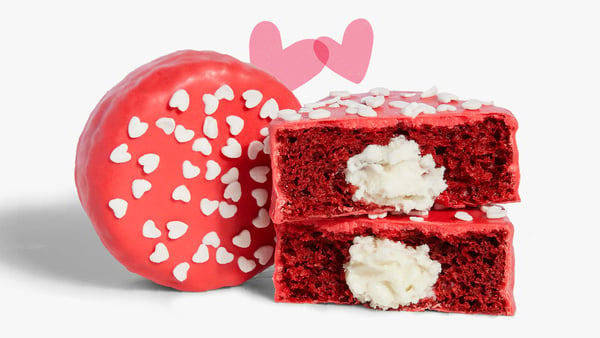 A MOD Red velvet No Name Cake has two halves stacked on top of each other, showcasing the cream cheese frosting.