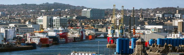 Knight Frank Aberdeen commercial office banner image: Oil rig support boats moored in the Port of Aberdeen, Scotland UK