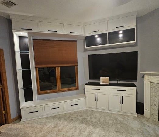 Living room media center with flip-up doors, box-in-box and glass shelves, plus lighting