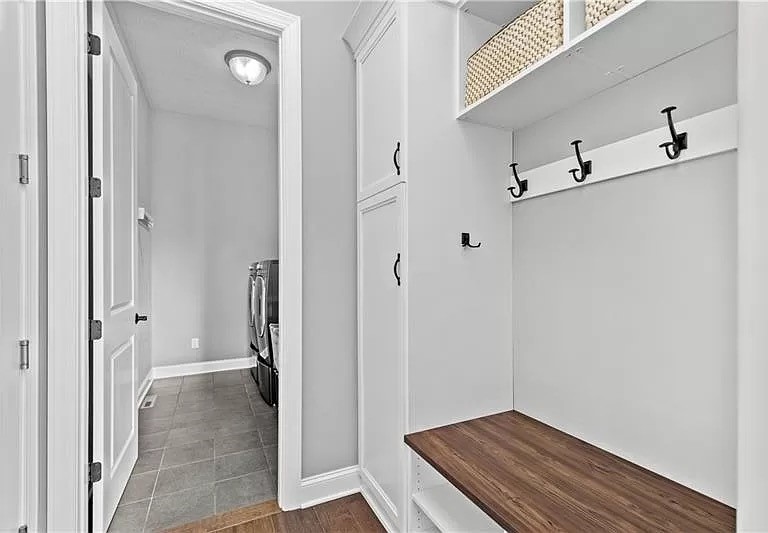 Custom Mudroom and Laundry Room By California Closets Pittsburgh in Pittsburgh, Pennsylvania. A variety of closet organizers and closet organization with laundry room cabinets.
