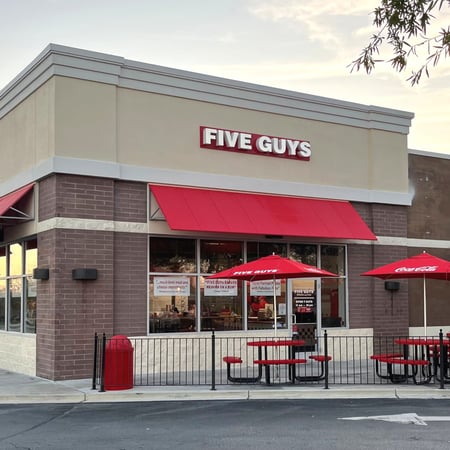 An exterior photograph of the Five Guys restaurant at 128 Rolling Hills Circle in Easley, South Carolina.