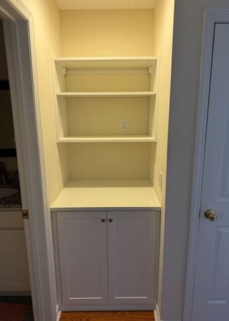 Wilmington - Custom closets - Compact nook built-in with cabinets below and open shelves above.