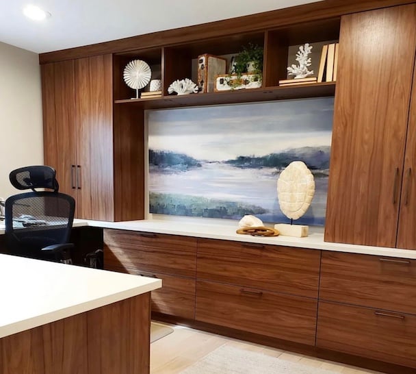 Custom home office with built-in custom cabinets, open shelving, and integrated storage solutions.
