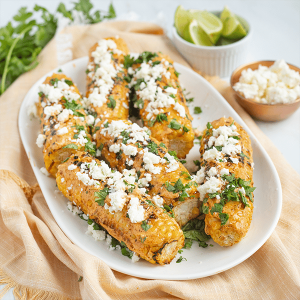 grilled corn on the cob with chili lime mayo feta cheese and cilantro