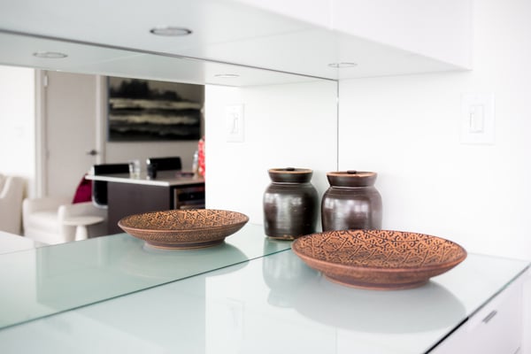 Close up of dining room buffet showing mirror back panel and surface space for display items