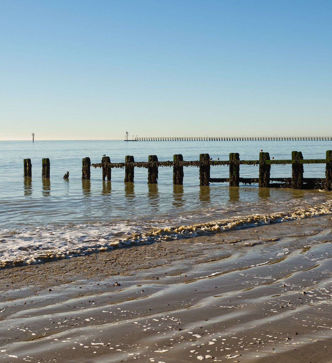 Calm sea at low tide in Littlehampton, West Sussex.