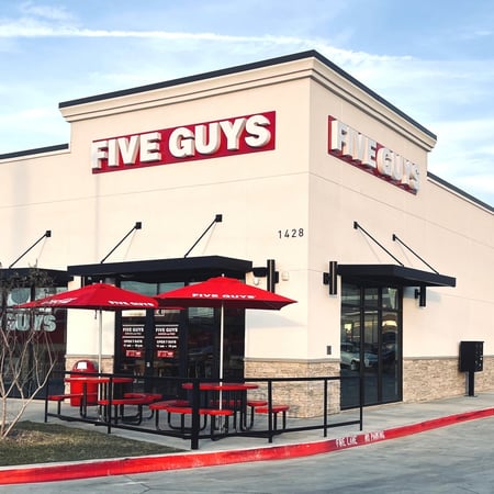 Exterior photograph of the Five Guys restaurant at 1428 North Old Decatur Road in Saginaw, Texas.