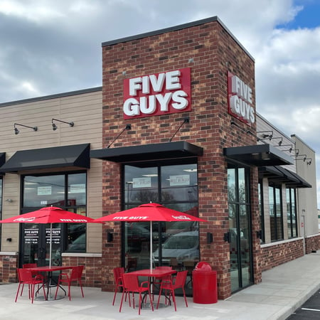 Exterior photograph of the Five Guys restaurant at 6910 South Lindbergh Boulevard in St. Louis, Missouri.