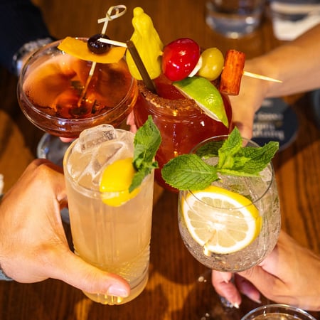 Cheers with a Mainhattan, Signature Caesar, Spicy Mango Mule and a Hugo Spritz