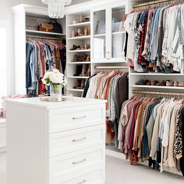 Luxe white walk-in closet with center island