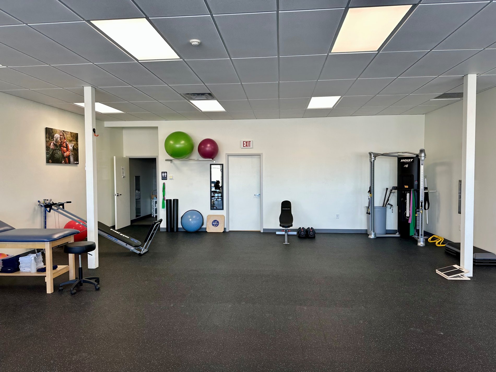 RI-NorthProvidence Bay State Physical Therapy patient care area with PT equipment.
