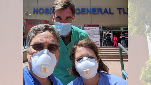 Dr. Jess Mandel is pictured on the left, fellow UC San Diego Health Dr. Timothy Morris is in green with ICU Nurse Kelly O’Connor pictured in front of Tijuana’s Hospital General.