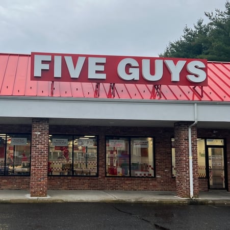 Exterior photograph of the Five Guys restaurant at 4220 Route 9 South in Howell, New Jersey.