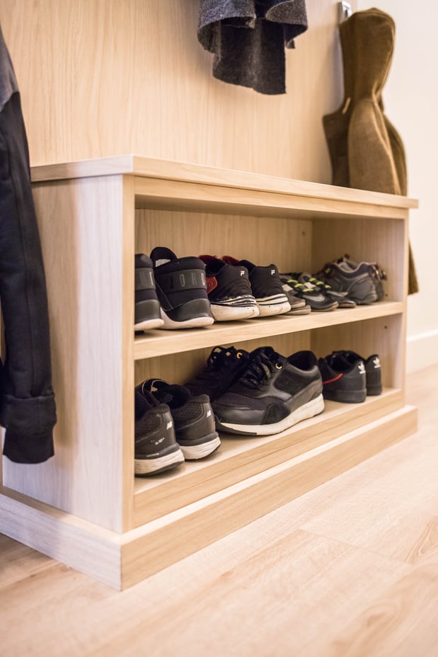 Mudroom shelving storage for shoes underneath a small bench