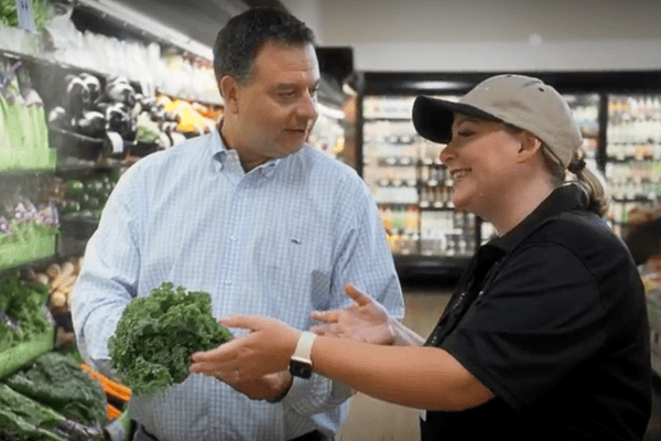 produce manager and customer