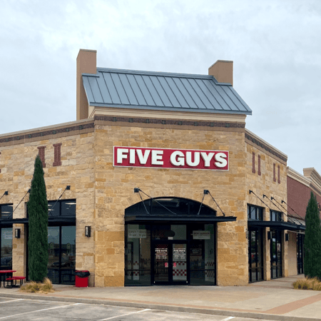 Front entrance to the Five Guys at 6076 Marsha Sharp Freeway in Lubbock, Texas.