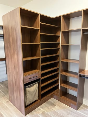 Large walk in closet with peninsula