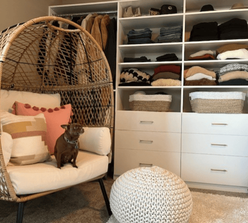 Bedroom closet with hanging space, drawers for organizing, and shelving.